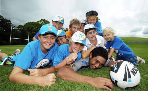 Titans’ centre Joseph Tomane had a training run with Camp Quality fans at Pacific Bay. Titans’ centre Joseph Tomane had a training run with Camp Quality fans at Pacific Bay.
